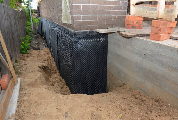 SJ Waterproofing Pros technician performing targeted Basement Waterproofing assessment in Botkins, OH